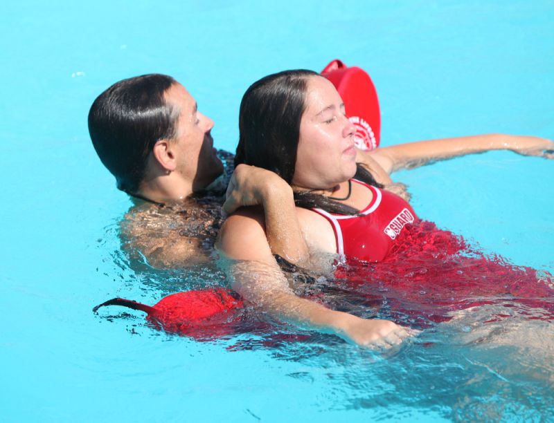 photo of 2 lifeguards training in the water